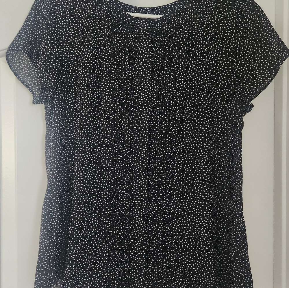 Banana Republic black and white polka dot button up shirt with pleats in front.